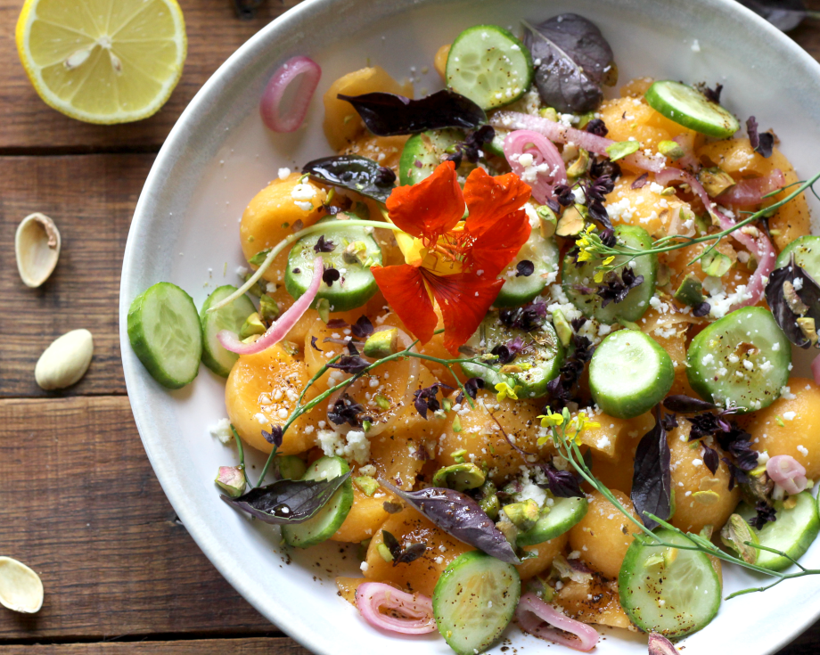 Cucumber and melon salad with edible flowers